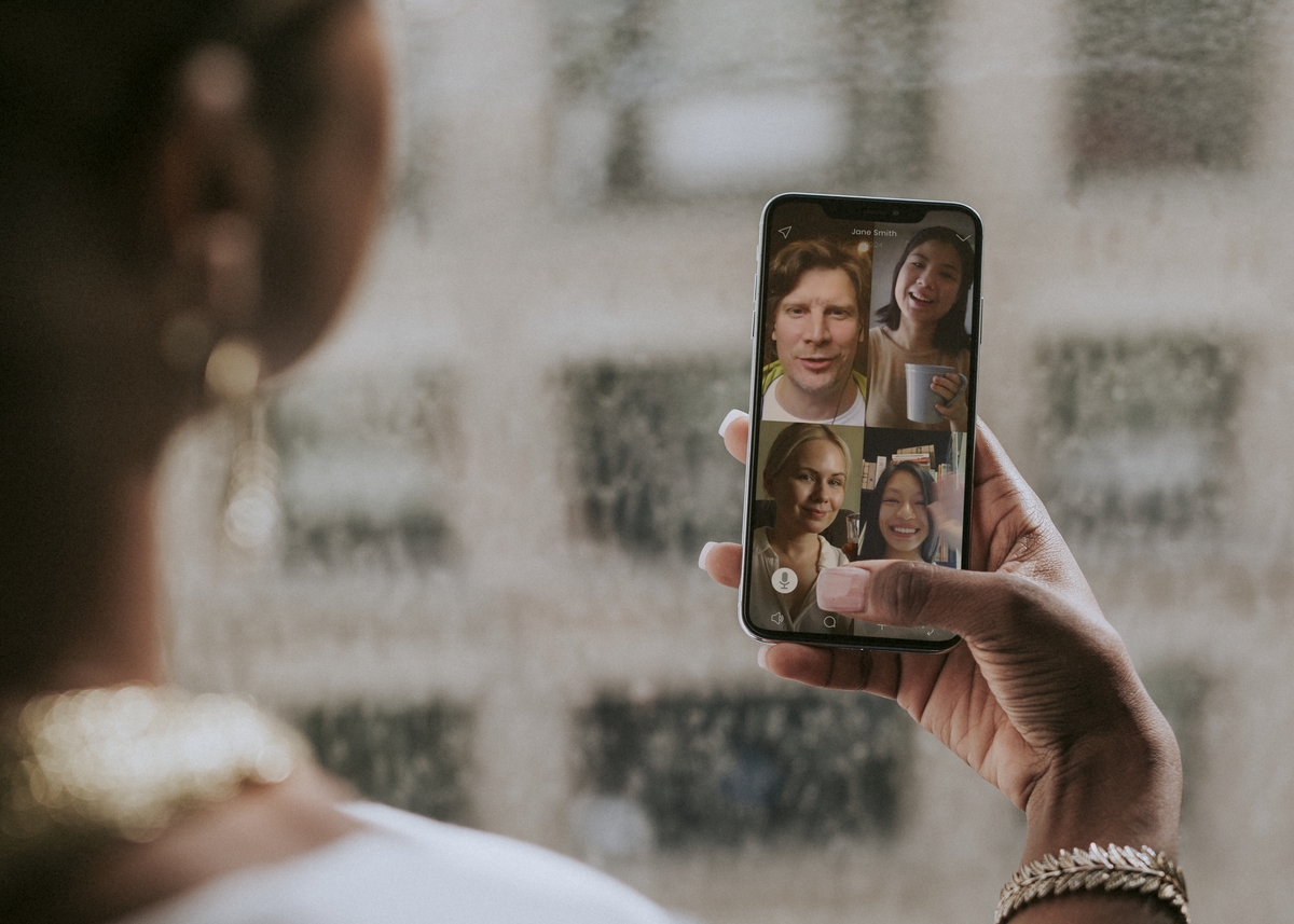 Colleagues having a video conference on a mobile phone